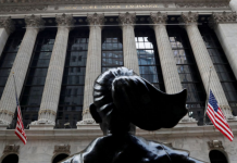 Stocks Wobble After Hitting Records Monday